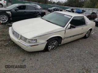 2001 Cadillac Eldorado ESC with VIN 1G6EL12Y41B101007, listed as a Copart auction lot 87553515 with 148,097 mi miles and Salvage Title. Bid and sale history available at carsss.com. Image 1.