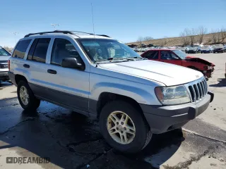 2003 Jeep Grand Cherokee Laredo with VIN 1J4GW48S13C556129, listed as a Copart auction lot 50389215 with 193,934 mi miles and Salvage Title. Bid and sale history available at carsss.com. Image 4.