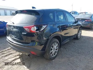 2014 Mazda CX-5 Touring z VIN JM3KE4CY4E0328880, wystawiony jako IAAI lot #42112302 z przebiegiem 185 228 mil mil oraz . Historia ofert i sprzedaży dostępna na DreamBid. Obrazek 4.