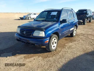 2003 Suzuki Vitara z VIN 2S3TE52V436101091, wystawiony jako IAAI lot #41472279 z przebiegiem 163 429 mil mil oraz . Historia ofert i sprzedaży dostępna na DreamBid. Obrazek 2.