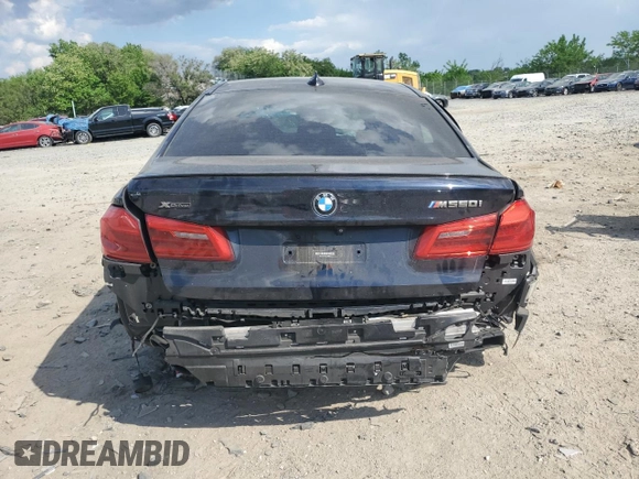 2020 BMW 5 Series M550i xDrive with VIN WBAJS7C03LCD00279, listed as a Copart auction lot 55698035 with 76,057 mi miles and Clean title. Bid and sale history available at DreamBid. Image 6.