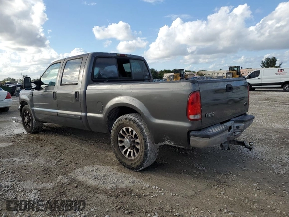 2002 Ford F-250 XL with VIN 1FTNW20F12EB93947, listed as a Copart auction lot 77836054 with 322,030 mi miles and Salvage Title. Bid and sale history available at DreamBid. Image 2.