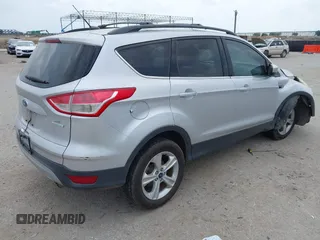 2013 Ford Escape SE with VIN 1FMCU0GX9DUD68711, listed as a IAAI auction lot 42243521 with 120,441 mi miles and . Bid and sale history available at DreamBid. Image 4.