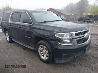 2015 Chevrolet Suburban LT z VIN 1GNSKJKC3FR154889, wystawiony jako IAAI lot #42175080 z przebiegiem 49 231 mil mil oraz . Historia ofert i sprzedaży dostępna na DreamBid. Obrazek 1.