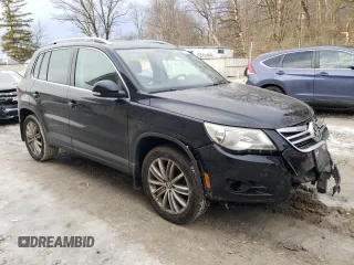 2011 Volkswagen Tiguan SEL with VIN WVGBV7AX4BW553986, listed as a Copart auction lot 43873765 with 140,097 mi miles and Salvage Title. Bid and sale history available at DreamBid. Image 4.