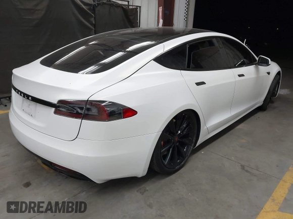 2017 Tesla Model S 100D z VIN 5YJSA1E2XHF224671, wystawiony jako IAAI lot #42665581 z przebiegiem 128 517 mil mil oraz . Historia ofert i sprzedaży dostępna na DreamBid. Obrazek 4.