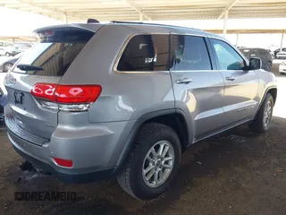 2018 Jeep Grand Cherokee Laredo E with VIN 1C4RJEAG3JC399869, listed as a IAAI auction lot 42305627 with 64,004 mi miles and . Bid and sale history available at DreamBid. Image 4.