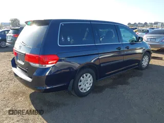 2008 Honda Odyssey LX with VIN 5FNRL382X8B043313, listed as a IAAI auction lot 42085879 with 164,522 mi miles. Bid and sale history available at carsss.com. Image 4.
