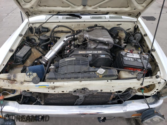 1993 Toyota Pickup DLX z VIN 4TAVN13D1PZ122508, wystawiony jako Copart lot #56737535 z przebiegiem 291 854 mil mil oraz Czysty tytuł • Clean title. Historia ofert i sprzedaży dostępna na DreamBid. Obrazek 11.