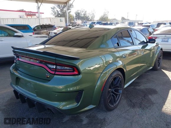 2022 Dodge Charger Scat Pack Widebody with VIN 2C3CDXGJ1NH216763, listed as a IAAI auction lot 41259159 with 32,610 mi miles and . Bid and sale history available at DreamBid. Image 4.