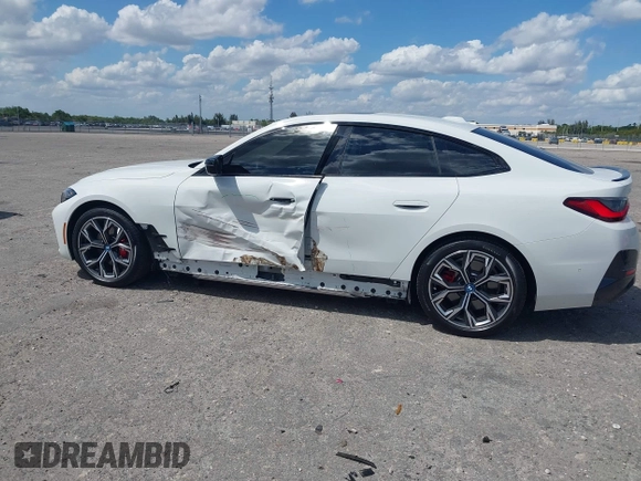2024 BMW i4 eDrive35 z VIN WBY43AW02RFS79370, wystawiony jako IAAI lot #41887964 z przebiegiem 11 910 mil mil oraz . Historia ofert i sprzedaży dostępna na DreamBid. Obrazek 20.