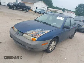 2000 Saturn SL z VIN 1G8ZF5280YZ108657, wystawiony jako IAAI lot #42414854 z przebiegiem 240 619 mil mil oraz . Historia ofert i sprzedaży dostępna na DreamBid. Obrazek 2.