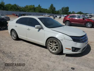 2012 Ford Fusion SEL z VIN 3FAHP0JA3CR336743, wystawiony jako Copart lot #45455065 z przebiegiem 126 456 mil mil oraz Szkody całkowita. Historia ofert i sprzedaży dostępna na DreamBid. Obrazek 4.