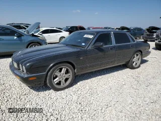 2002 Jaguar XJ with VIN SAJDA15BX2MF47193, listed as a Copart auction lot 49065275 with 69,544 mi miles and Salvage title. Bid and sale history available at DreamBid. Image 1.