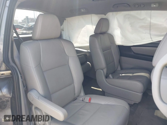 2014 Honda Odyssey EX-L with VIN 5FNRL5H60EB117218, listed as a IAAI auction lot 42201739 with 184,586 mi miles and . Bid and sale history available at DreamBid. Image 8.