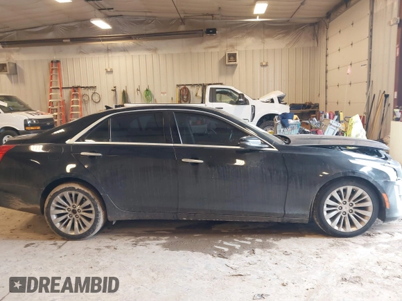 2014 Cadillac CTS Luxury AWD with VIN 1G6AX5SX2E0195357, listed as a IAAI auction lot 41677831 with 152,567 mi miles and . Bid and sale history available at DreamBid. Image 13.