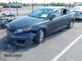 2015 Kia Optima LX with VIN KNAGM4A71F5634755, listed as a IAAI auction lot 42019729 with 101,064 mi miles and . Bid and sale history available at carsss.com. Image 2.