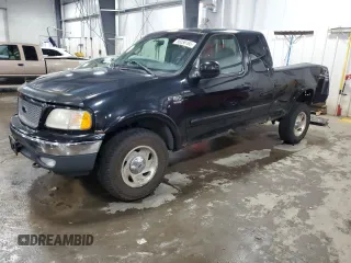 2000 Ford F-150 XL z VIN 1FTRX18L7YNA85909, wystawiony jako Copart lot #56056165 z przebiegiem 134 765 mil mil oraz Szkoda całkowita • Salvage title. Historia ofert i sprzedaży dostępna na DreamBid. Obrazek 1.