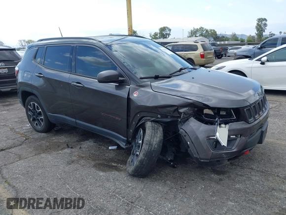 2021 Jeep Compass Trailhawk with VIN 3C4NJDDB6MT561074, listed as a IAAI auction lot 42125886 with 77,293 mi miles and . Bid and sale history available at DreamBid. Image 1.