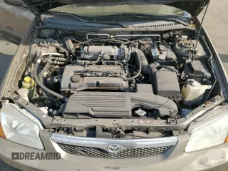 1999 Mazda Protege DX z VIN JM1BJ2223X0137153, wystawiony jako Copart lot #87899735 z przebiegiem 154 209 mil mil oraz Szkoda całkowita • Salvage title. Historia ofert i sprzedaży dostępna na DreamBid. Obrazek 13.