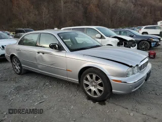 2005 Jaguar XJ with VIN SAJWA79C55SG37981, listed as a Copart auction lot 81142484 with 128,601 mi miles and Salvage Title. Bid and sale history available at carsss.com. Image 4.
