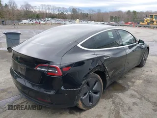 2019 Tesla Model 3 Mid Range with VIN 5YJ3E1EA3KF313425, listed as a IAAI auction lot 41806388 with 110,767 mi miles and . Bid and sale history available at carsss.com. Image 4.