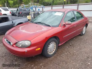 1999 Mercury Sable GS with VIN 1MEFM50UXXA649466, listed as a IAAI auction lot 42094811 with 122,644 mi miles. Bid and sale history available at carsss.com. Image 2.
