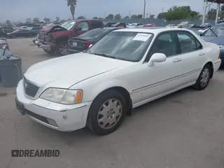 2004 Acura RL w/Navigation System z VIN JH4KA966X4C001584, wystawiony jako IAAI lot #42429042 z przebiegiem 290 258 mil mil oraz . Historia ofert i sprzedaży dostępna na DreamBid. Obrazek 2.