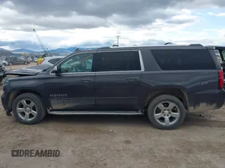 2018 Chevrolet Suburban Premier z VIN 1GNSKJKC3JR189621, wystawiony jako IAAI lot #41925416 z przebiegiem 150 775 mil mil oraz . Historia ofert i sprzedaży dostępna na DreamBid. Obrazek 14.