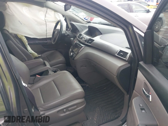 2016 Honda Odyssey Touring Elite with VIN 5FNRL5H97GB010048, listed as a IAAI auction lot 40212711 with 119,009 mi miles and . Bid and sale history available at DreamBid. Image 5.
