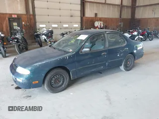 1996 Nissan Altima XE with VIN 1N4BU31D4TC139105, listed as a IAAI auction lot 40241213 with 115,817 mi miles and . Bid and sale history available at DreamBid. Image 2.