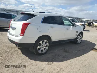 2014 Cadillac SRX Premium Collection z VIN 3GYFNGE32ES573872, wystawiony jako Copart lot #49871955 z przebiegiem 119 362 mil mil oraz Szkody całkowita. Historia ofert i sprzedaży dostępna na DreamBid. Obrazek 3.