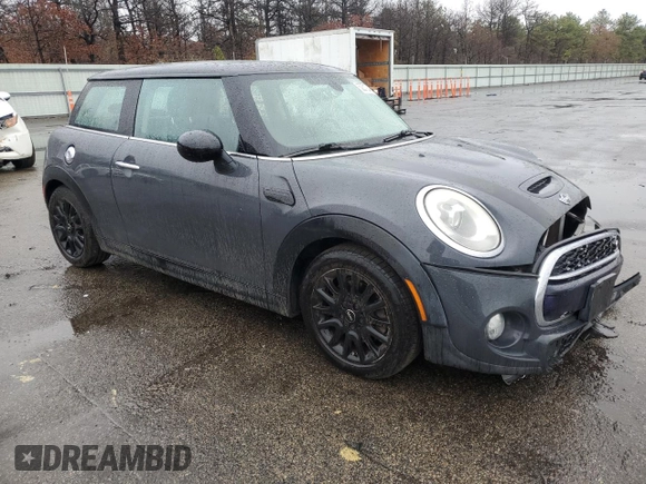 2014 MINI Hardtop S with VIN WMWXM7C54ET985344, listed as a Copart auction lot 52012465 with 87,017 mi miles and Salvage title. Bid and sale history available at DreamBid. Image 4.