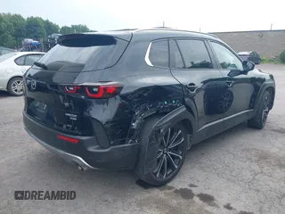 2023 Mazda CX-50 Meridian Edition with VIN 7MMVABXY1PN145913, listed as a IAAI auction lot 42632620 with 23,444 mi miles and . Bid and sale history available at DreamBid. Image 4.