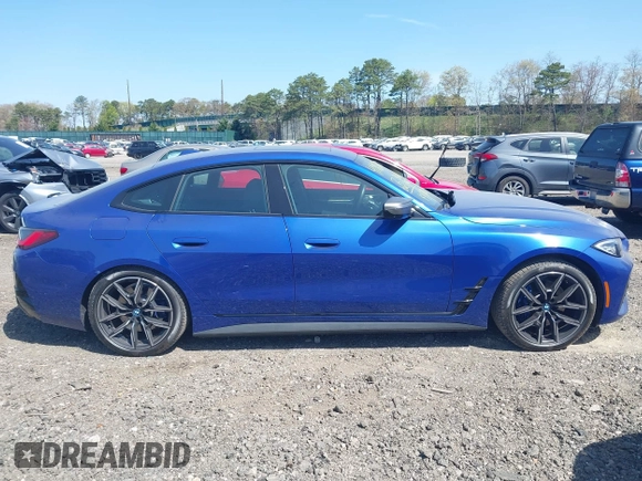 2024 BMW i4 M50 z VIN WBY33AW09RFS60679, wystawiony jako IAAI lot #41983706 z przebiegiem 2665 mil mil oraz . Historia ofert i sprzedaży dostępna na DreamBid. Obrazek 13.