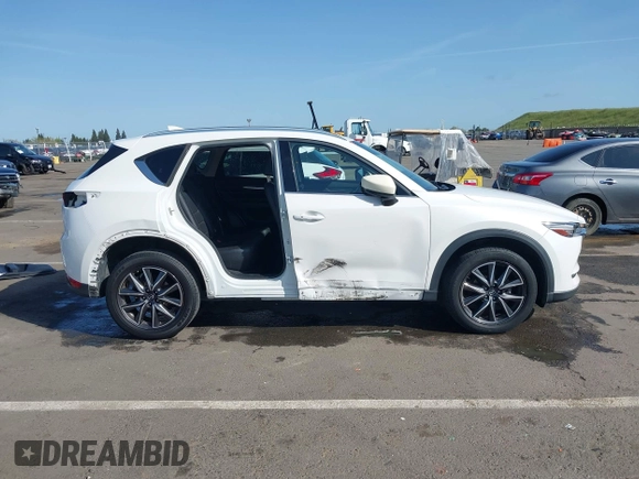 2017 Mazda CX-5 Grand Touring with VIN JM3KFADLXH0222341, listed as a IAAI auction lot 41990464 with 94,374 mi miles and . Bid and sale history available at carsss.com. Image 14.
