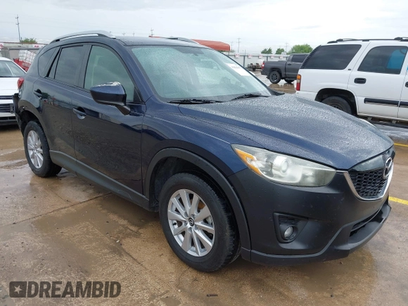 2015 Mazda CX-5 Touring with VIN JM3KE2CY5F0449195, listed as a IAAI auction lot 41894567 with 124,694 mi miles and . Bid and sale history available at DreamBid. Image 1.