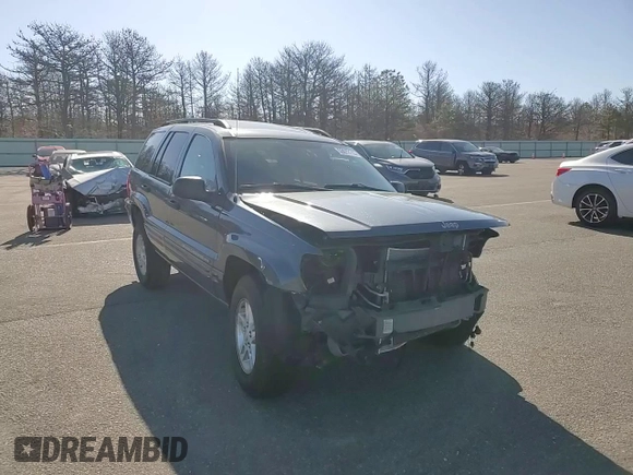 2004 Jeep Grand Cherokee Laredo z VIN 1J4GW48S74C159381, wystawiony jako Copart lot #53972115 z przebiegiem 128 309 mil mil oraz Szkoda całkowita • Salvage title. Historia ofert i sprzedaży dostępna na DreamBid. Obrazek 14.