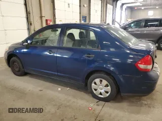 2009 Nissan Versa 1.6 z VIN 3N1CC11E49L458857, wystawiony jako Copart lot #59195275 z przebiegiem 100 351 mil mil oraz Szkoda całkowita • Salvage title. Historia ofert i sprzedaży dostępna na DreamBid. Obrazek 2.