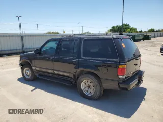1997 Ford Explorer XLT with VIN 1FMDU35P5VZB51640, listed as a Copart auction lot 52030474 with 214,647 mi miles and Clean title. Bid and sale history available at DreamBid. Image 2.