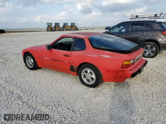 1987 Porsche 944 z VIN WP0AB0946HN476255, wystawiony jako Copart lot #79870704 z przebiegiem 177 672 mil mil oraz Czysty tytuł • Clean title. Historia ofert i sprzedaży dostępna na DreamBid. Obrazek 2.