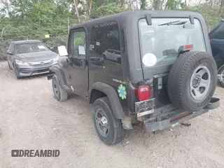 1995 Jeep Wrangler S with VIN 1J4FY19P4SP242027, listed as a IAAI auction lot 42149833 with 158,695 mi miles. Bid and sale history available at carsss.com. Image 3.