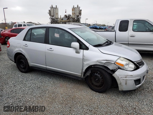 2011 Nissan Versa S with VIN 3N1BC1AP9BL458761, listed as a Copart auction lot 57317115 with 122,606 mi miles and Salvage title. Bid and sale history available at DreamBid. Image 4.
