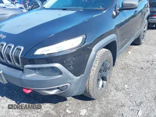 2016 Jeep Cherokee Trailhawk z VIN 1C4PJMBS6GW162742, wystawiony jako IAAI lot #42383200 z przebiegiem 124 791 mil mil oraz . Historia ofert i sprzedaży dostępna na DreamBid. Obrazek 6.