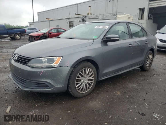 2012 Volkswagen Jetta SE with VIN 3VWDX7AJ0CM408784, listed as a Copart auction lot 56673235 with 203,203 mi miles and Salvage title. Bid and sale history available at DreamBid. Image 1.
