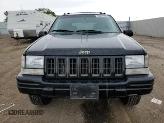 1997 Jeep Grand Cherokee Limited z VIN 1J4GZ78Y8VC586034, wystawiony jako Copart lot #58061705 z przebiegiem 244 355 mil mil oraz Czysty tytuł • Clean title. Historia ofert i sprzedaży dostępna na DreamBid. Obrazek 5.