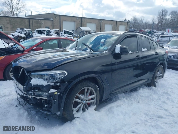 2021 BMW X4 M40i with VIN 5UX2V5C05M9H02711, listed as a IAAI auction lot 41675953 with 26,652 mi miles. Bid and sale history available at carsss.com. Image 19.