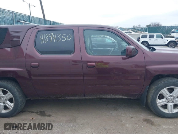 2011 Honda Ridgeline RTL with VIN 5FPYK1F51BB007959, listed as a IAAI auction lot 41894350 with 186,926 mi miles. Bid and sale history available at carsss.com. Image 13.