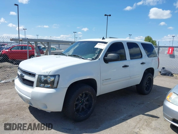 2007 Chevrolet Tahoe LS with VIN 1GNFC13C77J404051, listed as a IAAI auction lot 42093772 with 213,729 mi miles and . Bid and sale history available at DreamBid. Image 2.