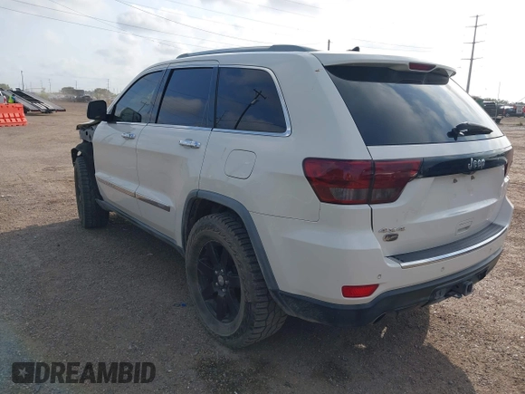 2011 Jeep Grand Cherokee Overland Summit with VIN 1J4RR6GT9BC586712, listed as a IAAI auction lot 42427655 with 157,549 mi miles and . Bid and sale history available at DreamBid. Image 3.